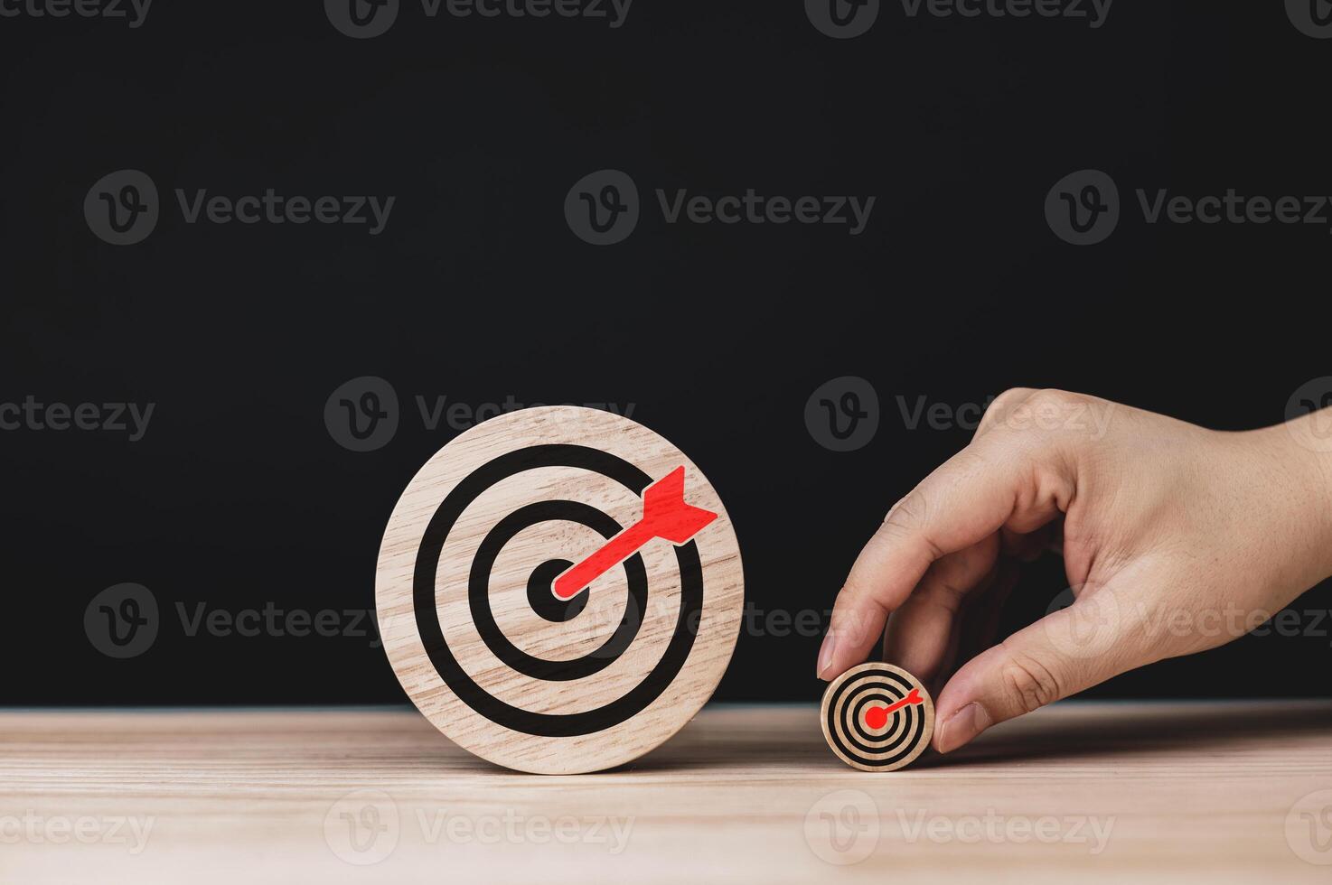 Determination and success. Two wooden circles with target icons of different sizes. concepts of methods and planning for setting goals starting from small goals to big goals. photo