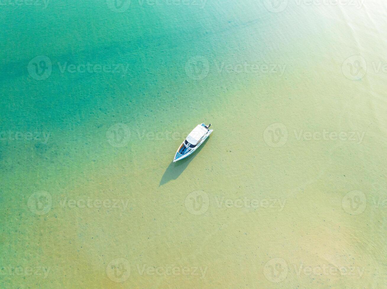 a boat floating in the water photo
