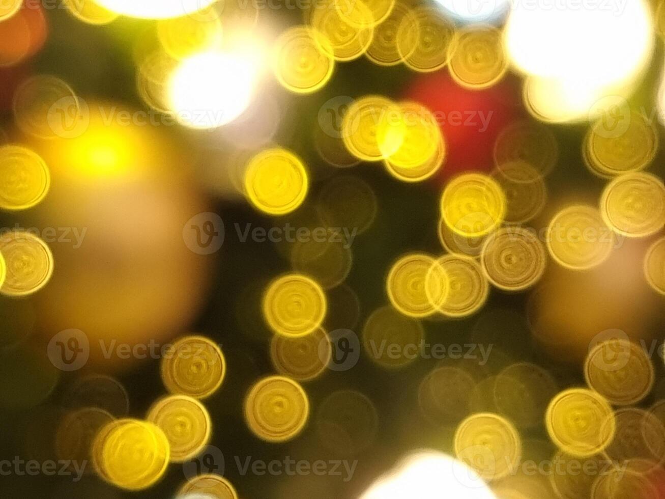 abstract bokeh blur light circle red yellow and white glowing flare pattern black background photo