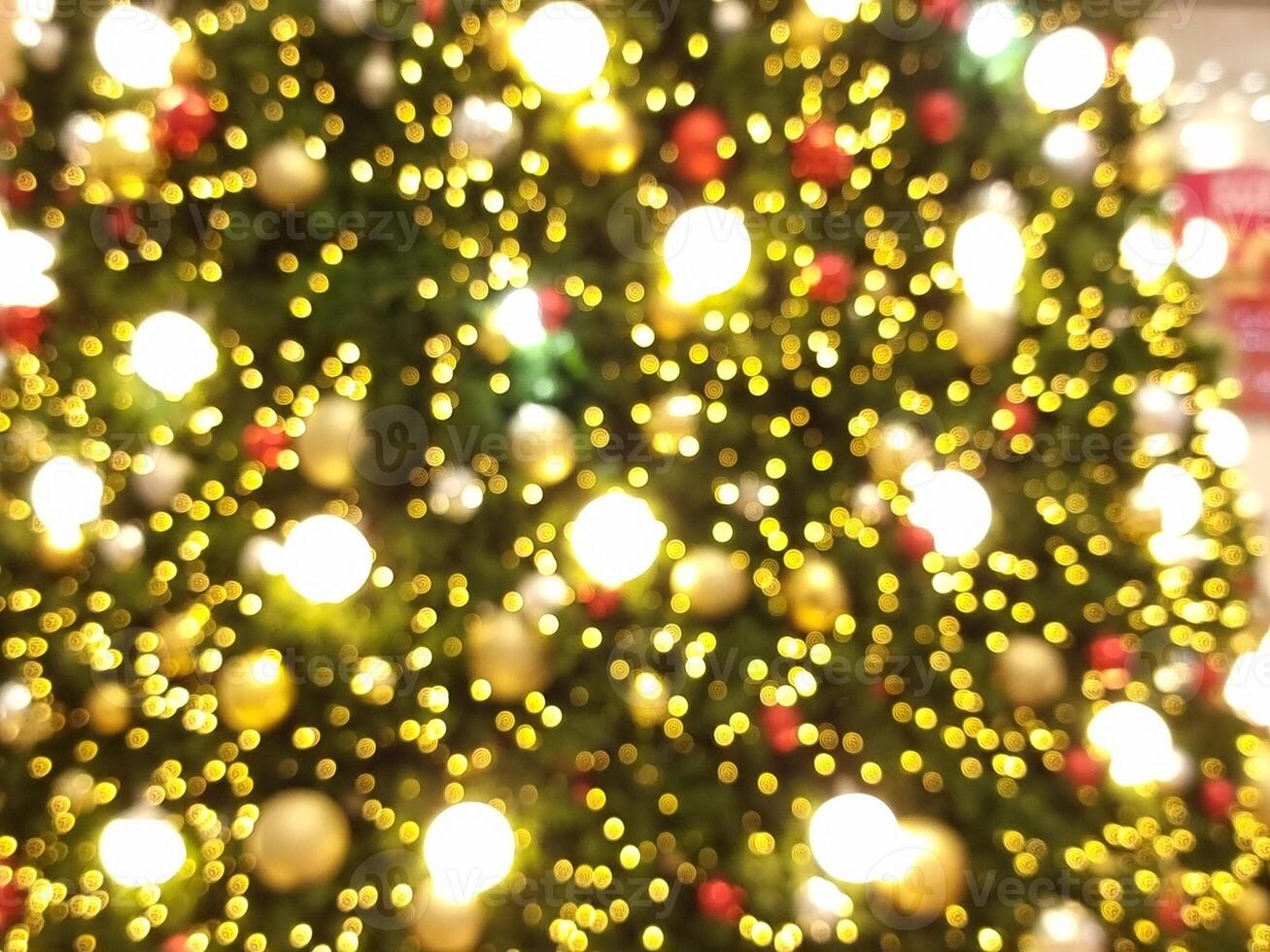 decoration christmas tree abstract bokeh blur light circle red orange and white glowing flare pattern black background photo