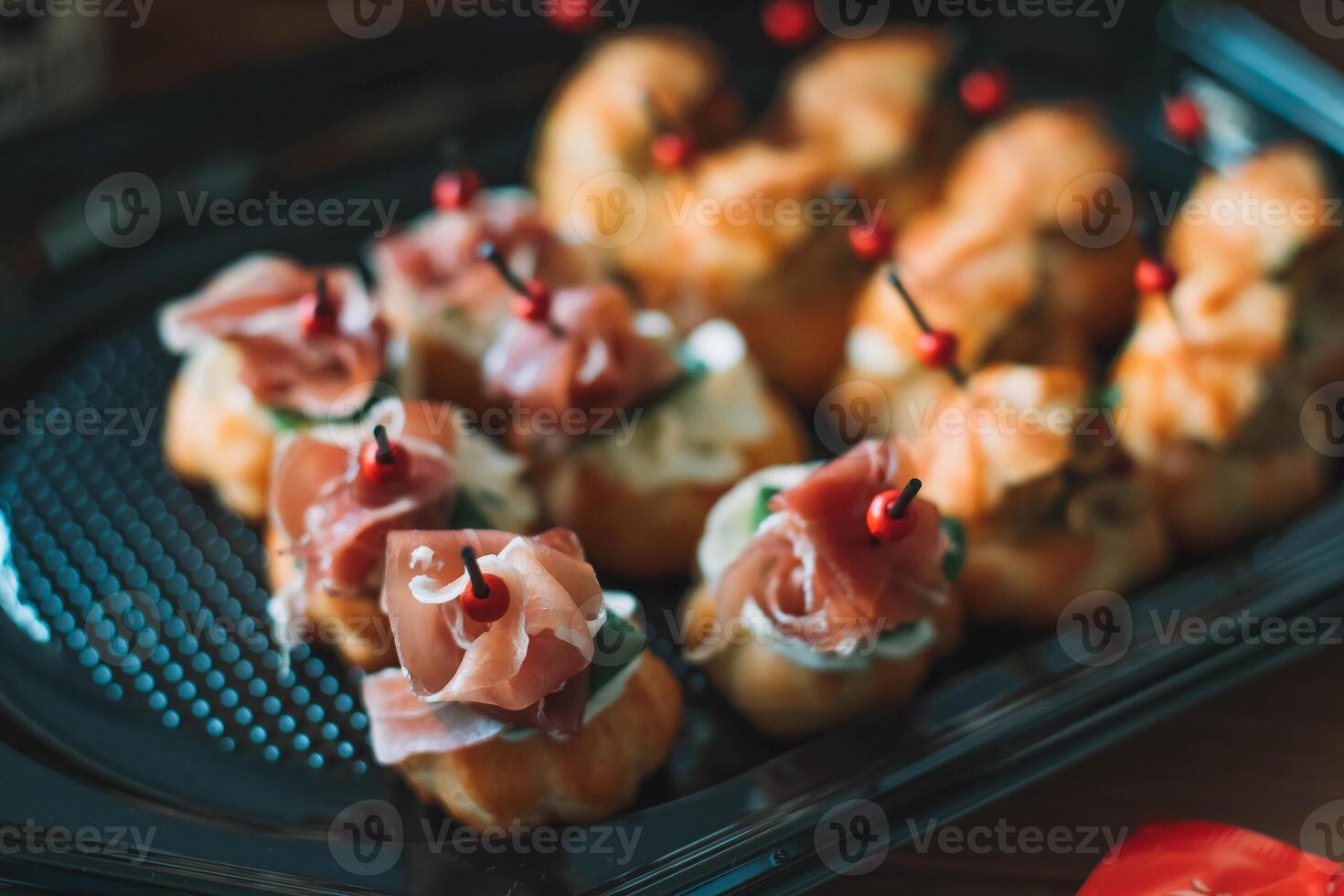 Appetizer canape with prosciutto and salami photo