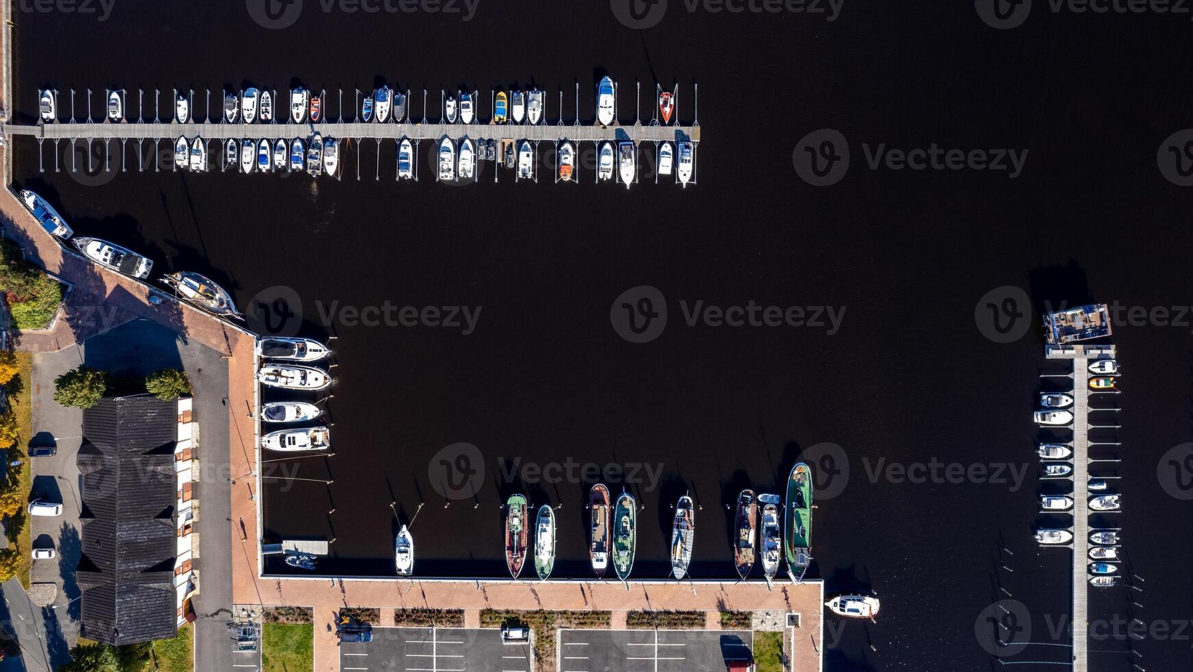 Aerial drone scenery of fishing boats and tourist yachts moored at the marina. Kuopio harbor Finland photo