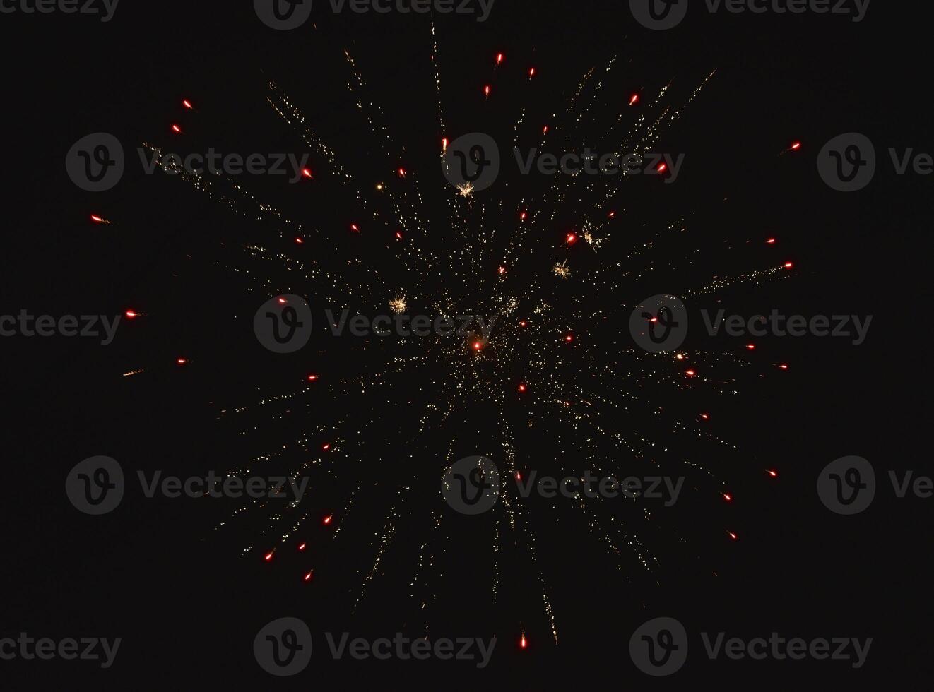 Fireworks shot at night. New Year's fireworks in the black sky. Christmas lights. photo
