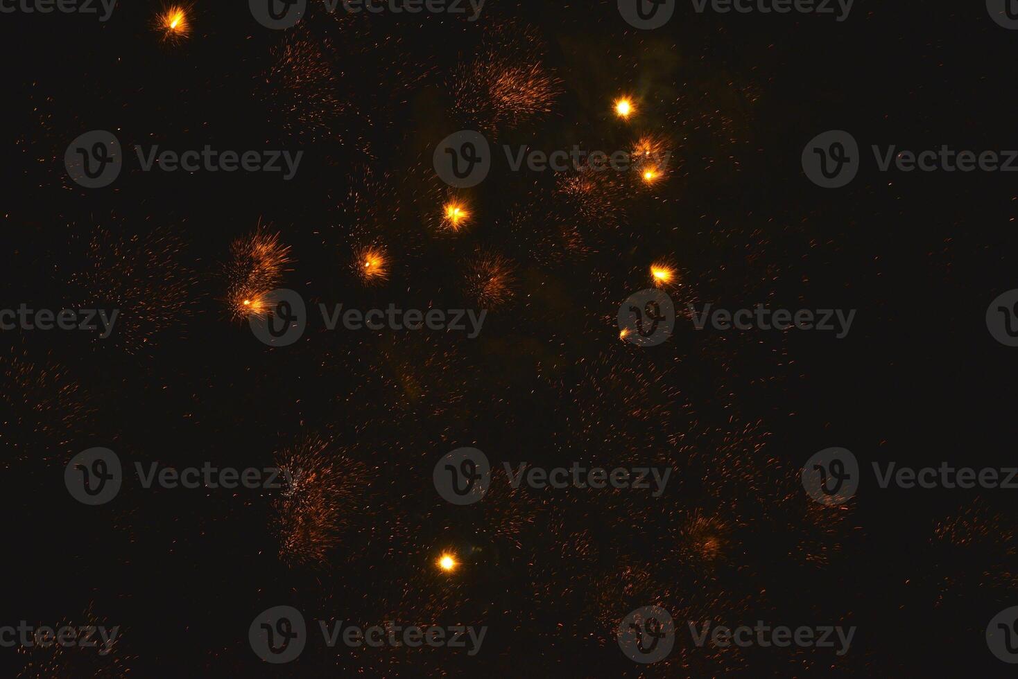 Fireworks shot at night. New Year's fireworks in the black sky. Christmas lights. photo