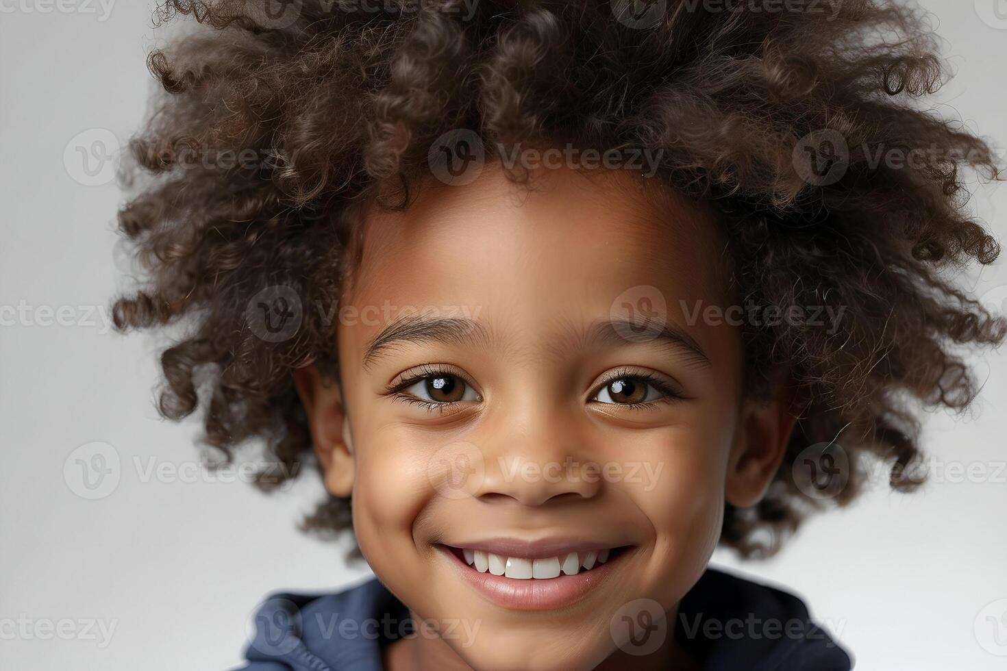 AI generated Studio closeup image of a cute black boy with a big afro hairstyle smiling. photo