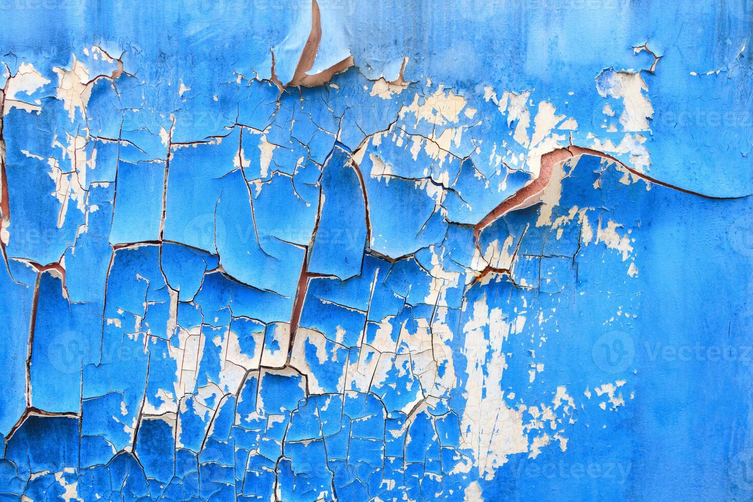 Detail of an old metal wall, rust and cracked paint photo