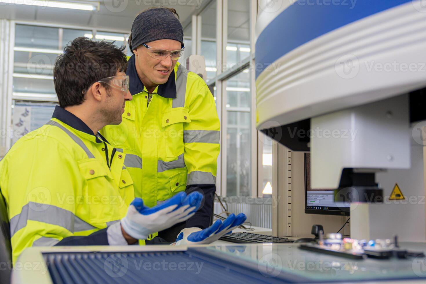 Male automation machine engineer training Programmable logic controller Technical Industrial Engineer control robotics with monitoring system software, photo