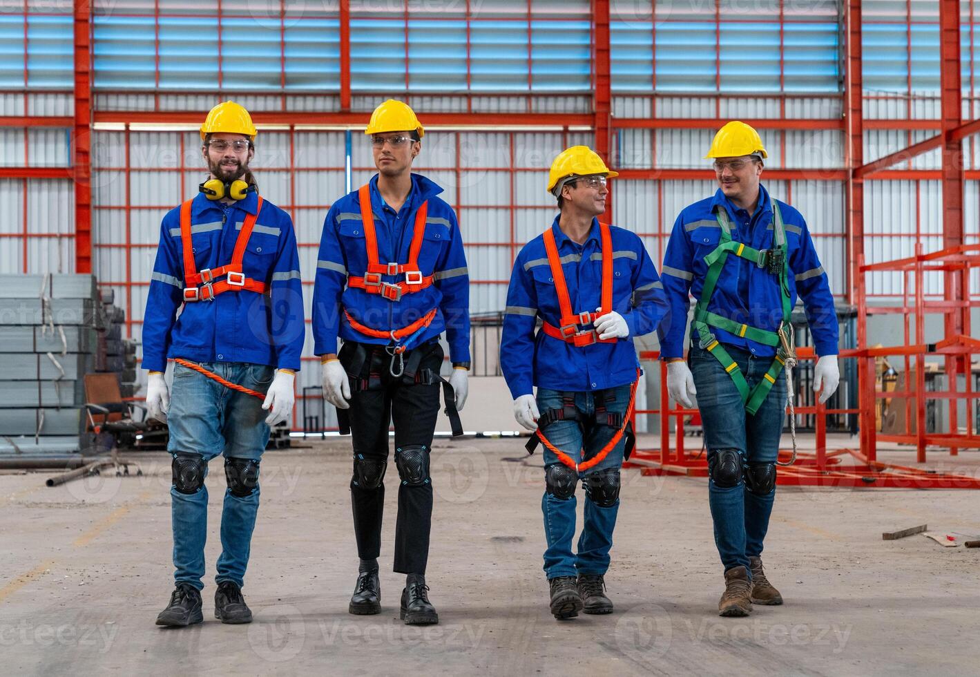 Craftsmen team is successful and makes high five motivation in a factory hallProfessional industry engineer and factory foreman worker team person Wearing safety helmet hard hat, Technician Team. photo