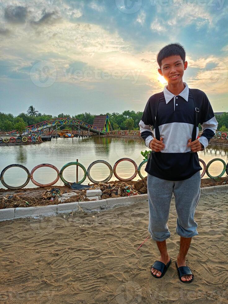 A boy on a mangrove beach in the afternoon photo