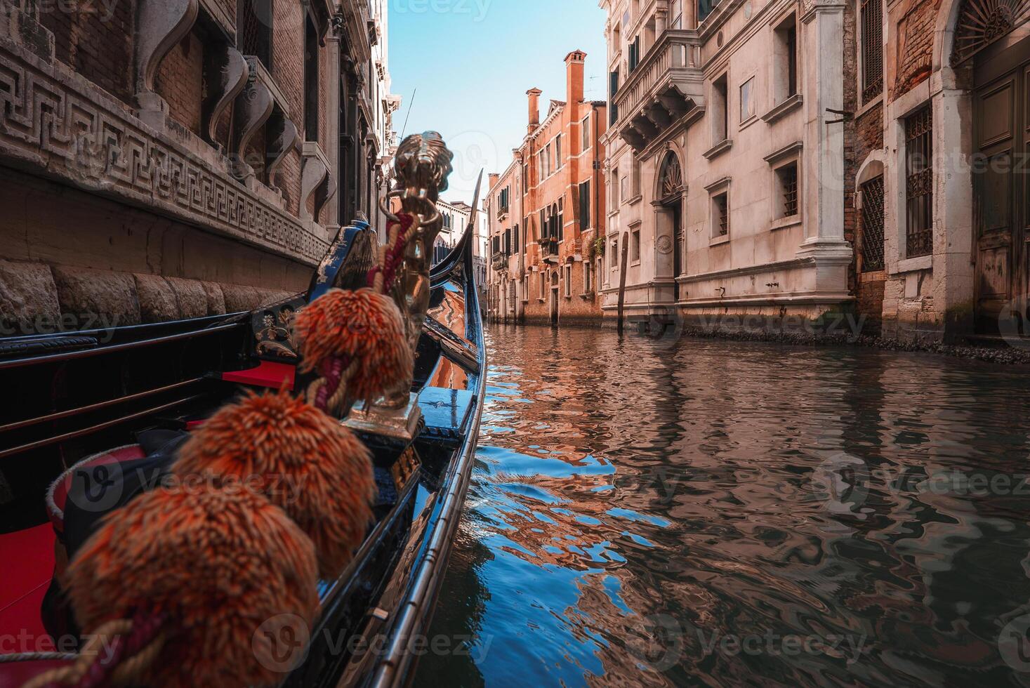 Iconic Gondola Navigating Through Venice Canal - Summer Collection photo