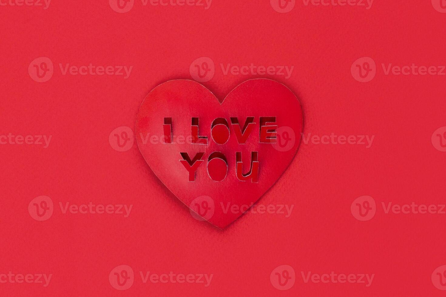 Valentine card shape heart with cut out inscription I love you red photo