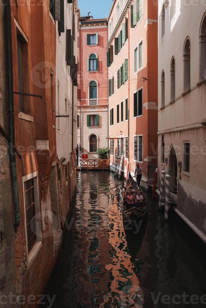 Tranquil View of Narrow Canal in Venice, Italy with Historic Architecture and Serene Waterway photo