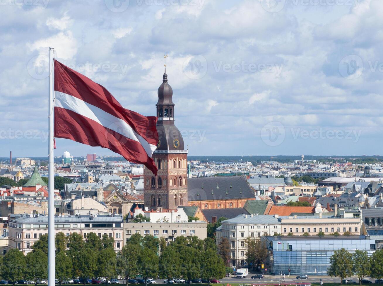 Panorama of Riga city with a big Latvian flag in foreground photo