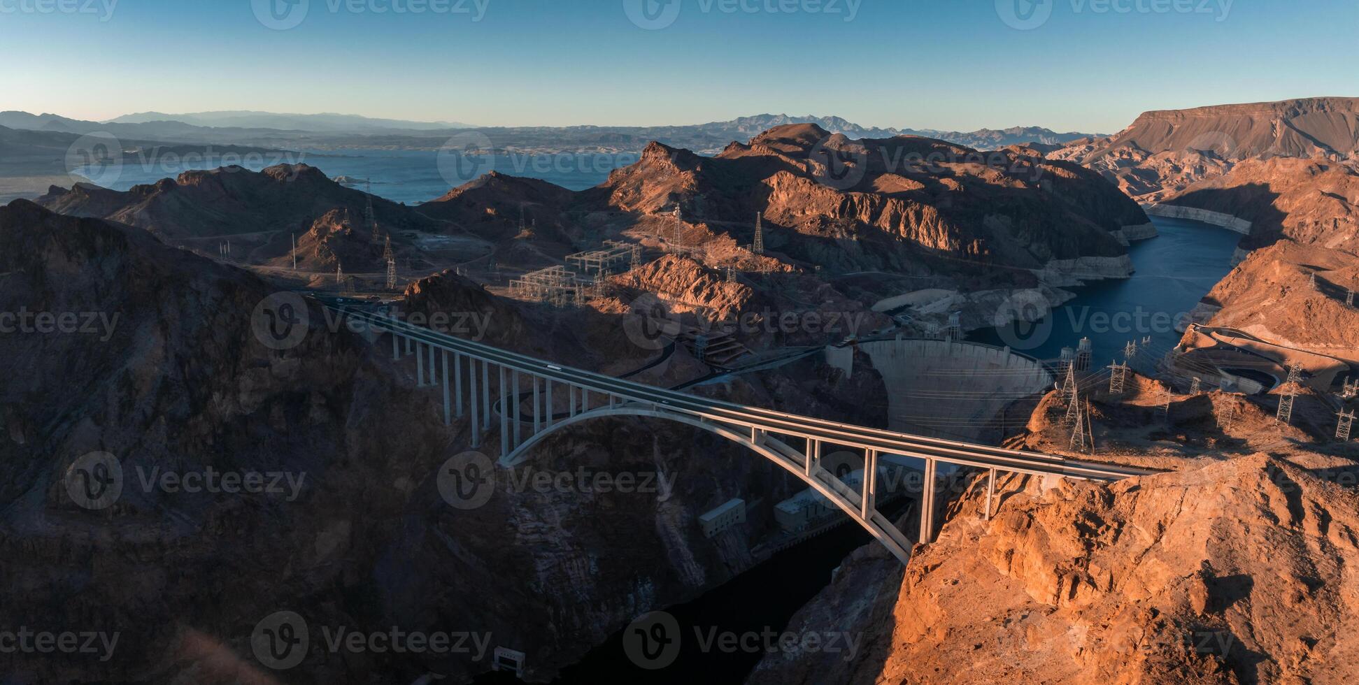 Hoover Dam on the Colorado River straddling Nevada and Arizona at dawn from above. photo