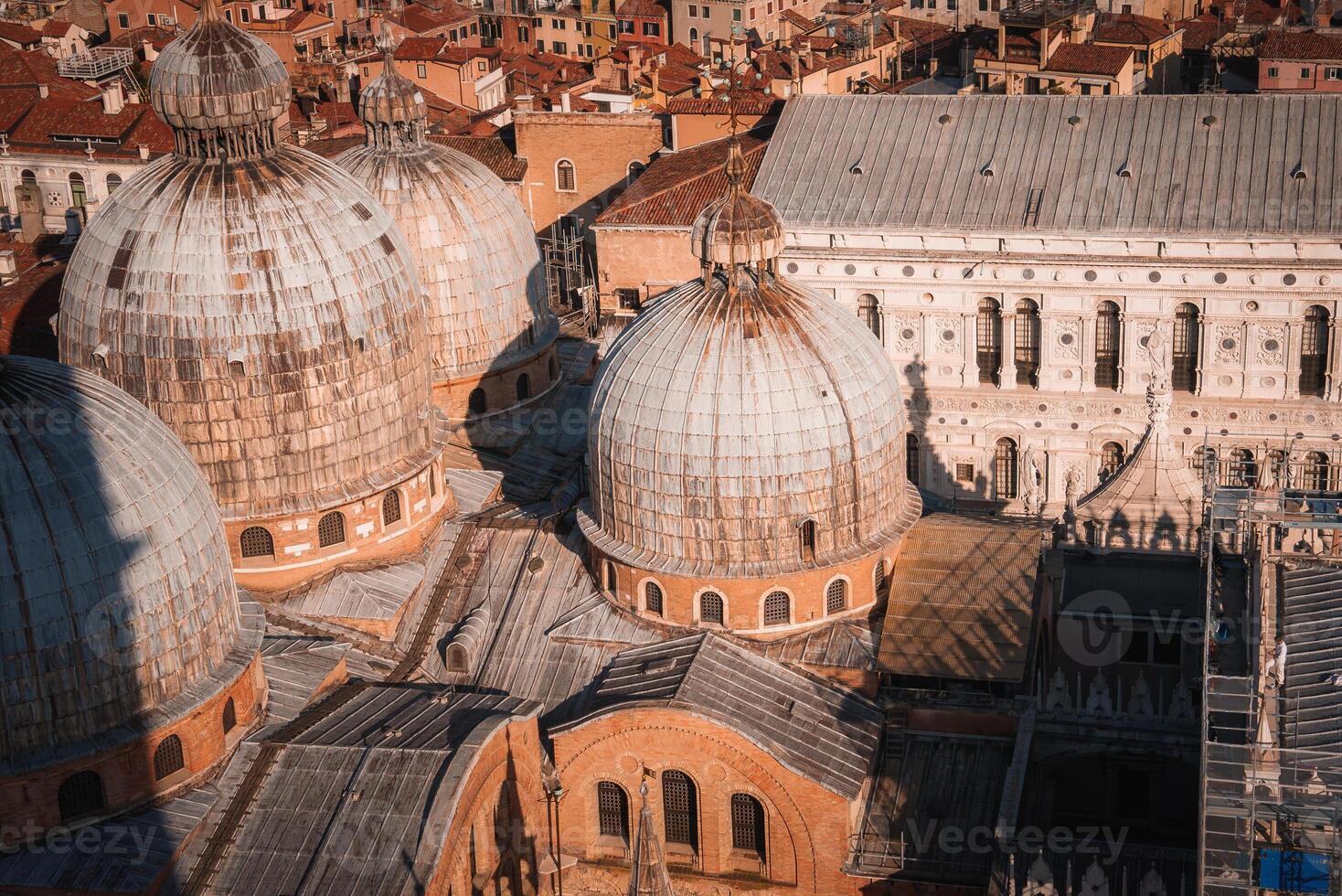 Aerial view of gray domes in Venice, Italy - distinctive architectural feature of the city. photo