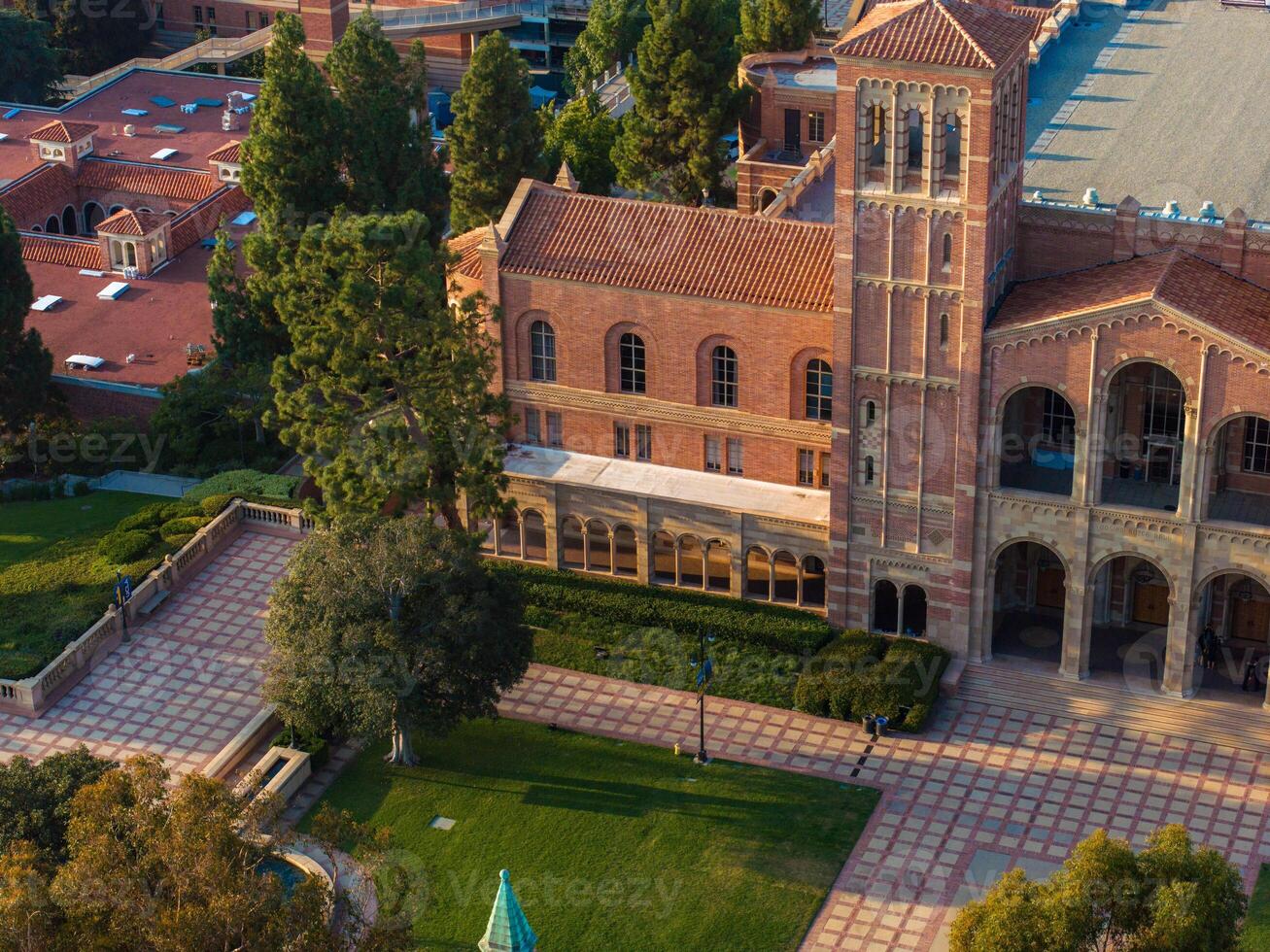 Aerial View of Romanesque Revival University Campus with Red Brick Buildings and Green Lawns photo