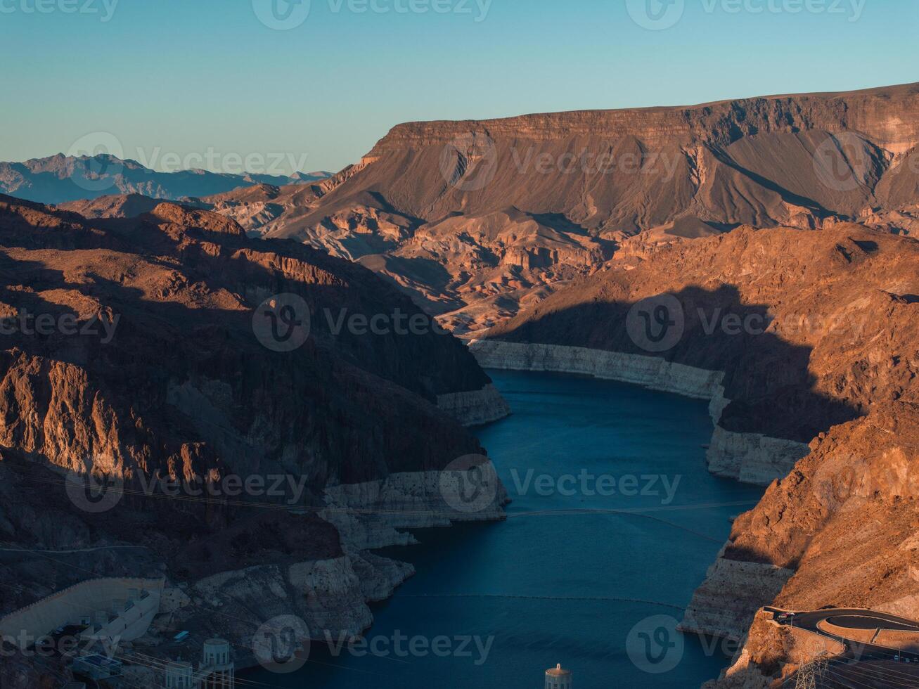 Hoover Dam on the Colorado River straddling Nevada and Arizona at dawn from above. photo