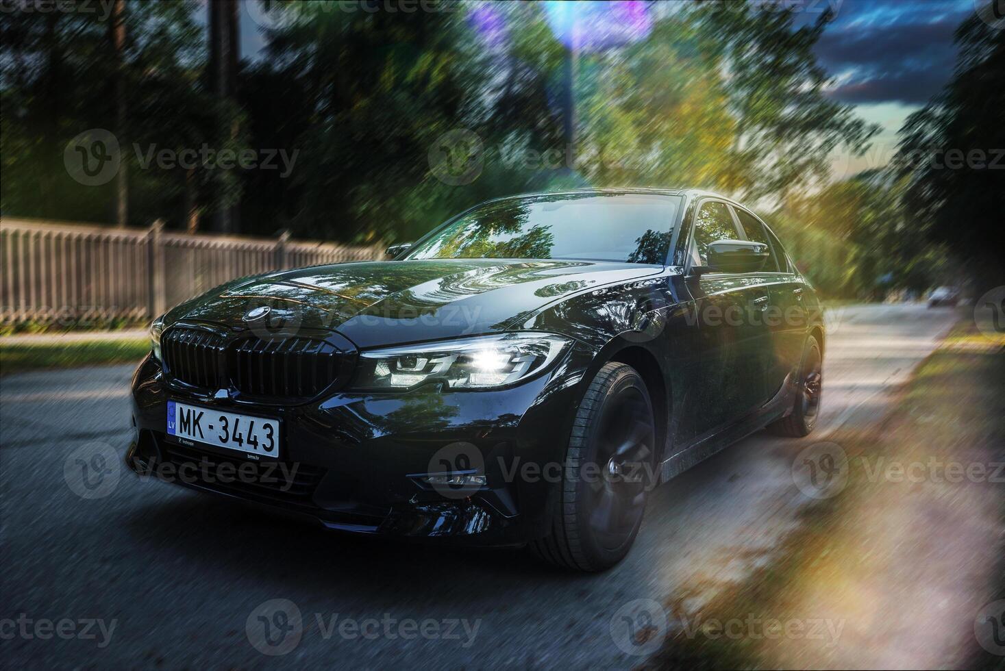 BMW 320 G20 parked on the street of Latvia. photo