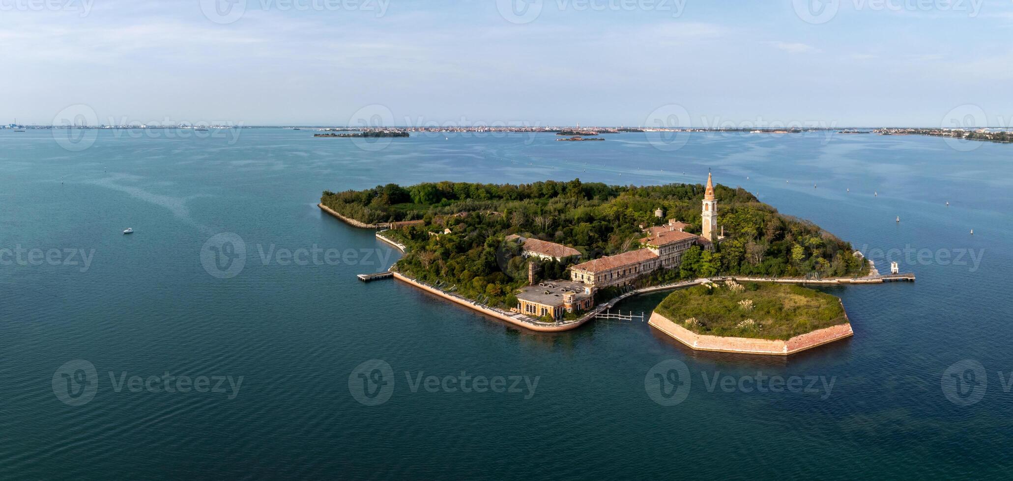 Aerial view of the plagued ghost island of Poveglia in the Venetian lagoon photo