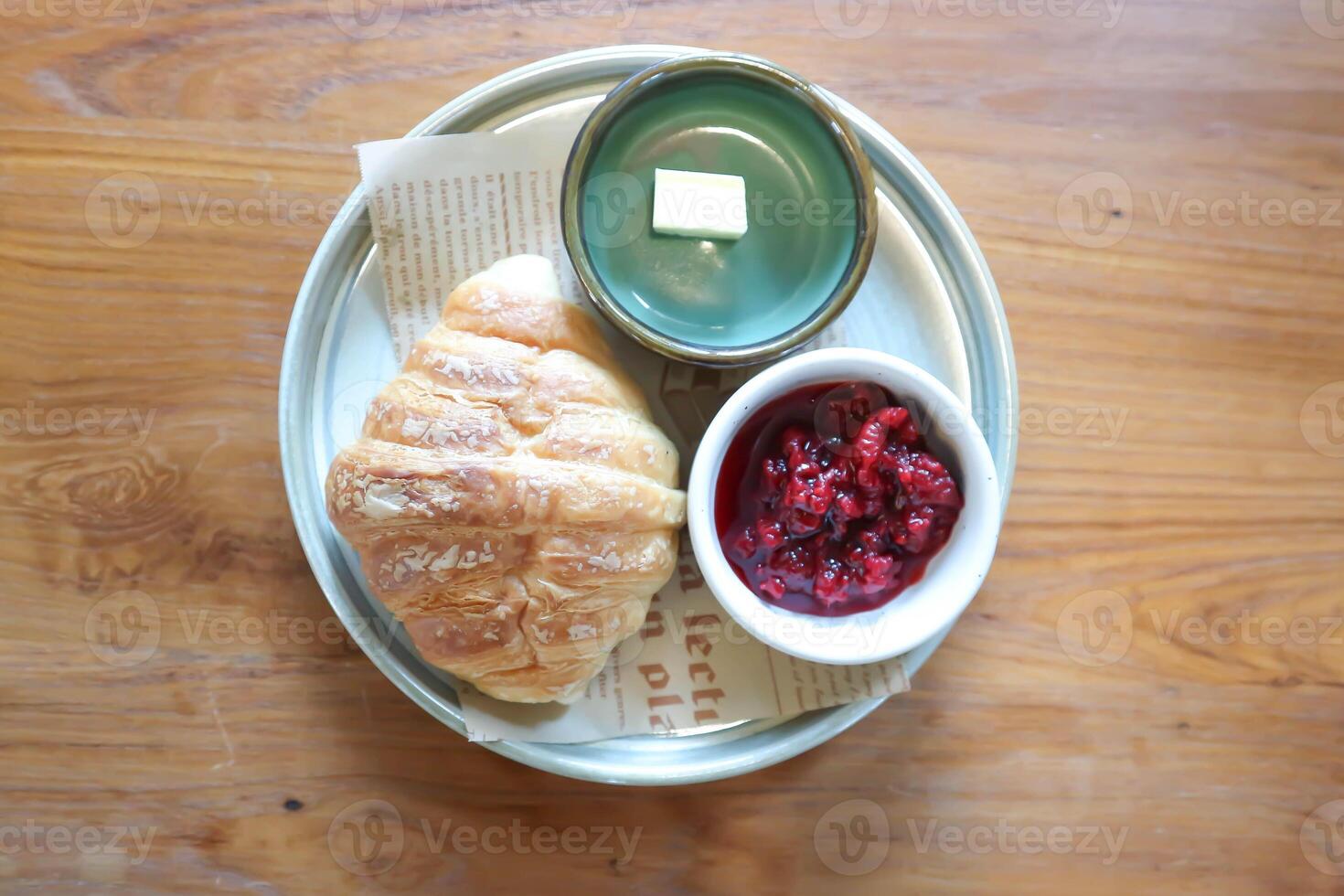 croissant ,French croissant or chocolate croissant or French bread with butter and blueberry dressing photo