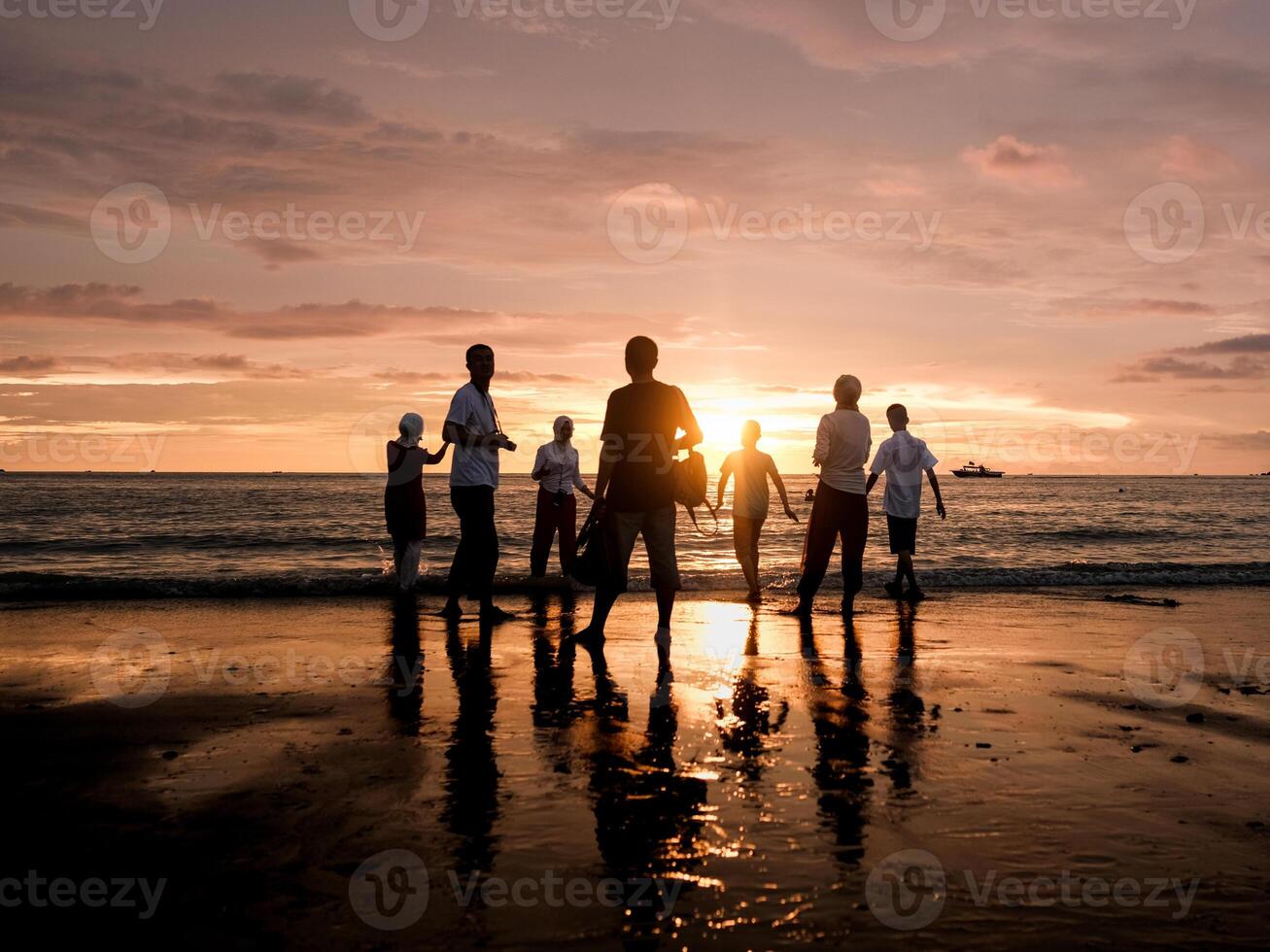 Silhouette of people the beach during sunset photo