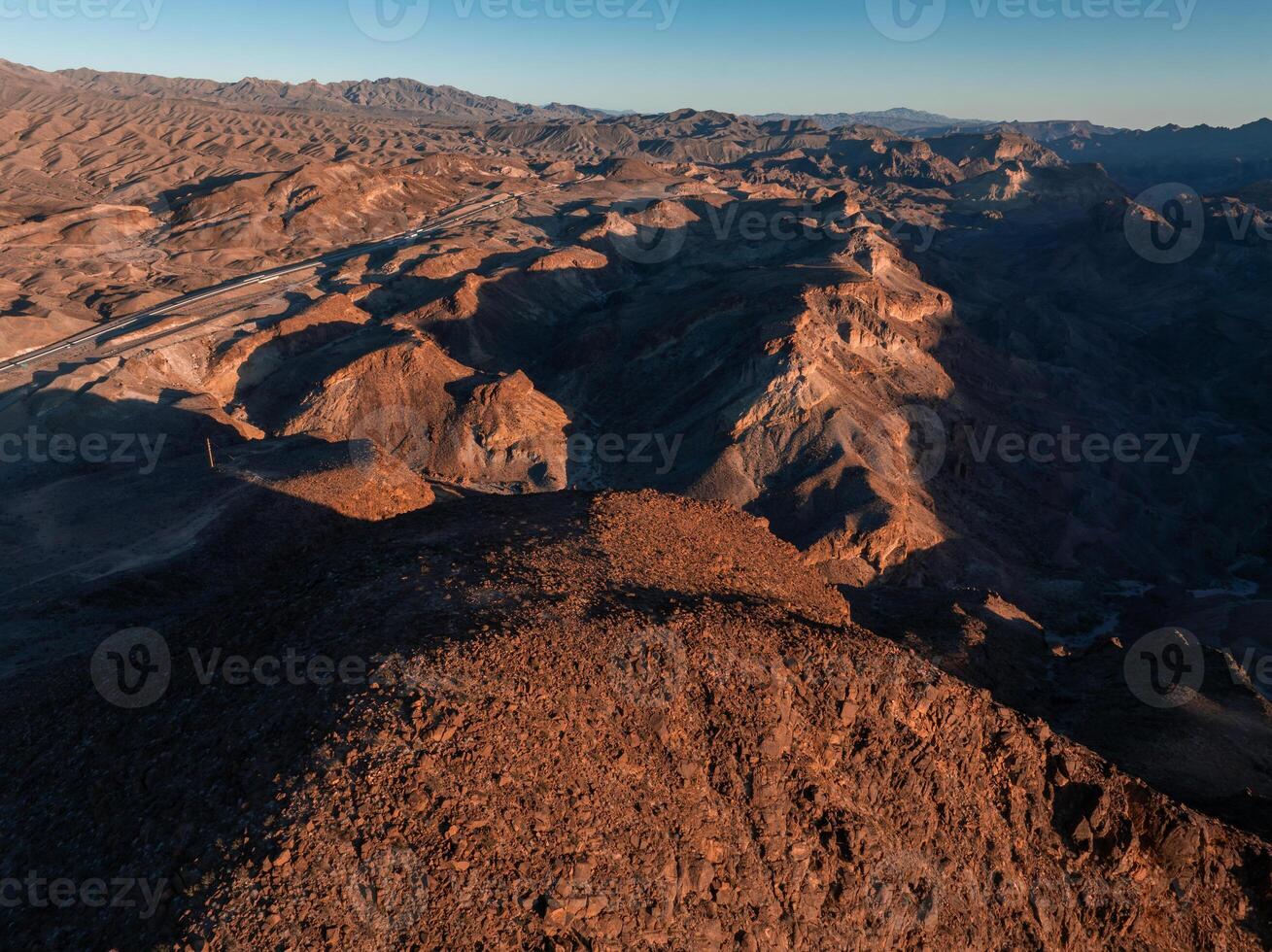 Hoover Dam on the Colorado River straddling Nevada and Arizona at dawn from above. photo