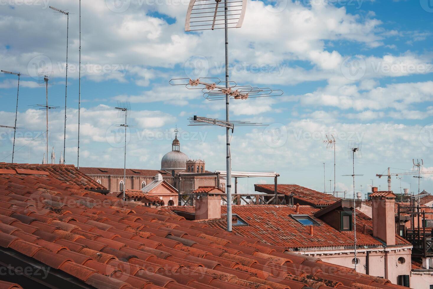 Tranquil and Serene View of Vibrant Red Rooftops in Iconic Venice, Italy photo