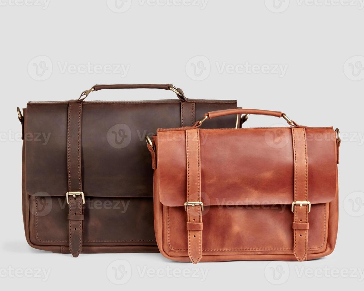 Two stylish leather messenger bags with personalized embossing photo