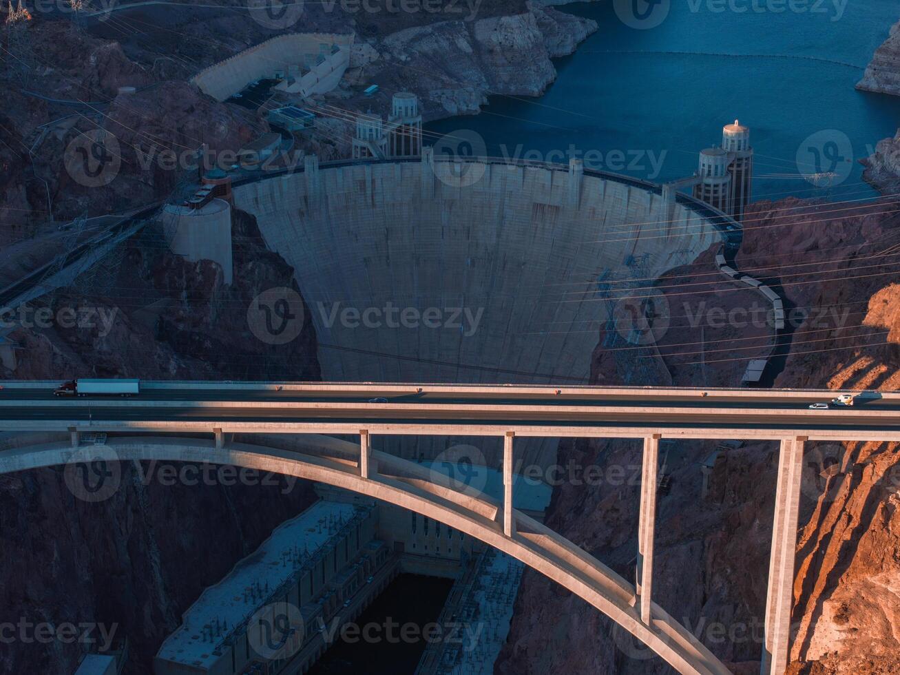 Hoover Dam on the Colorado River straddling Nevada and Arizona at dawn from above. photo