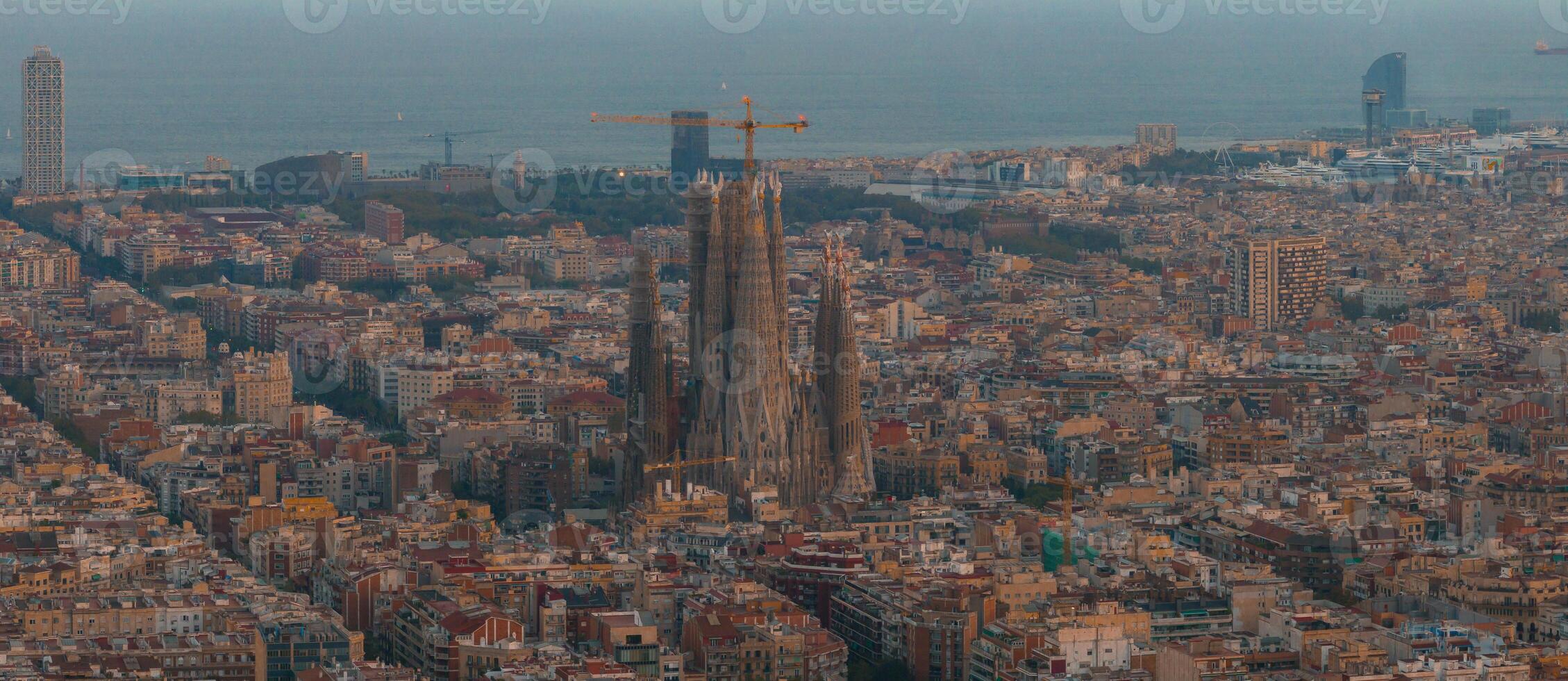 Aerial view of Barcelona City Skyline and Sagrada Familia Cathedral at sunset photo
