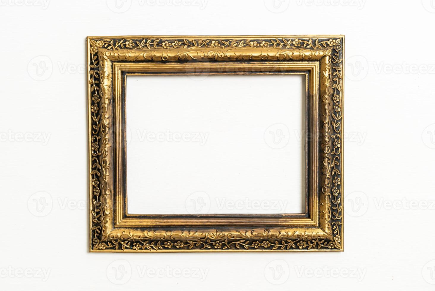 empty picture frame on white wall background photo