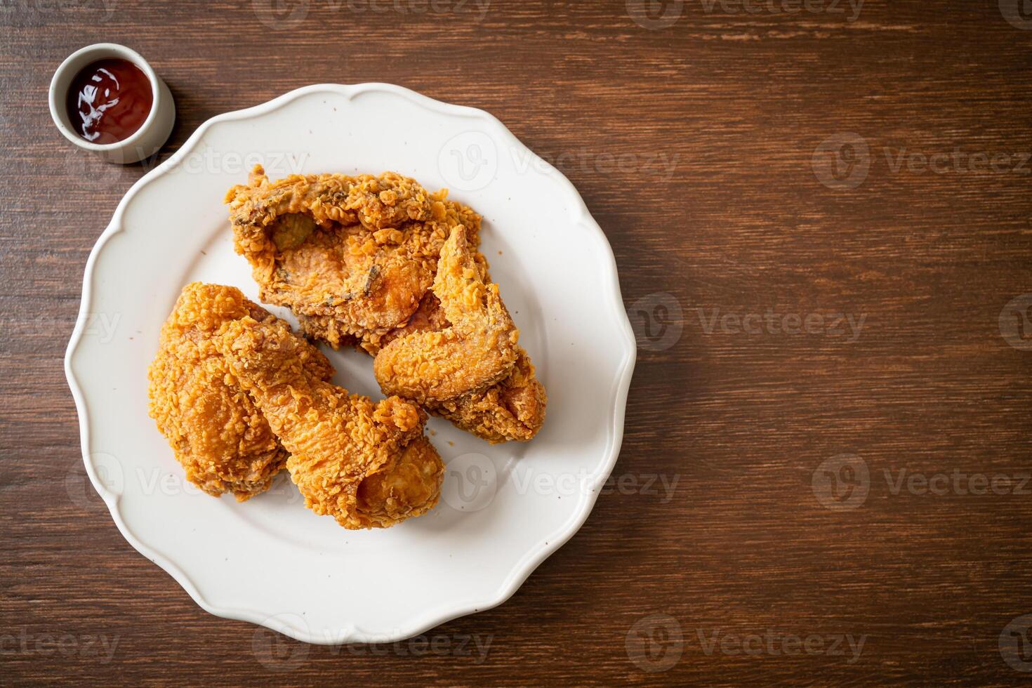 fried chicken with ketchup on plate photo