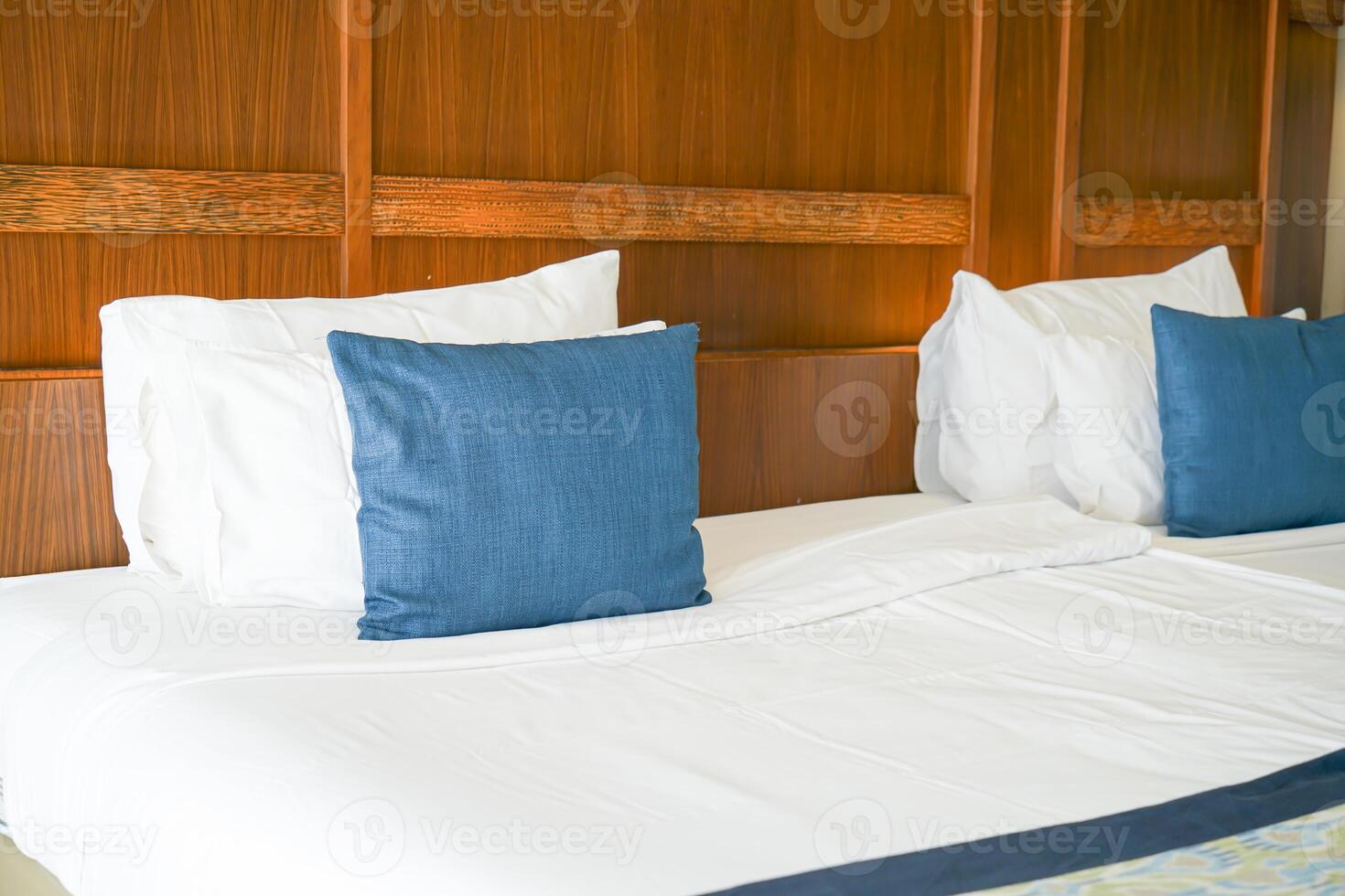 comfortable pillows and white pillows on bed photo