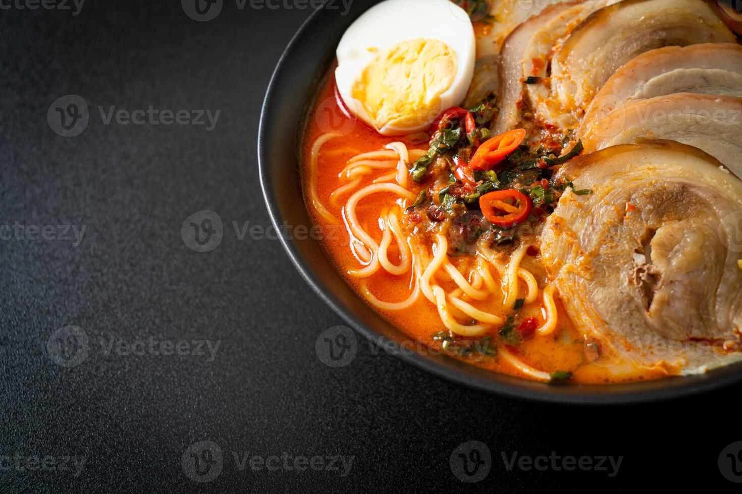 Ramen Noodles Spicy Tomyum Soup with Roast Pork photo