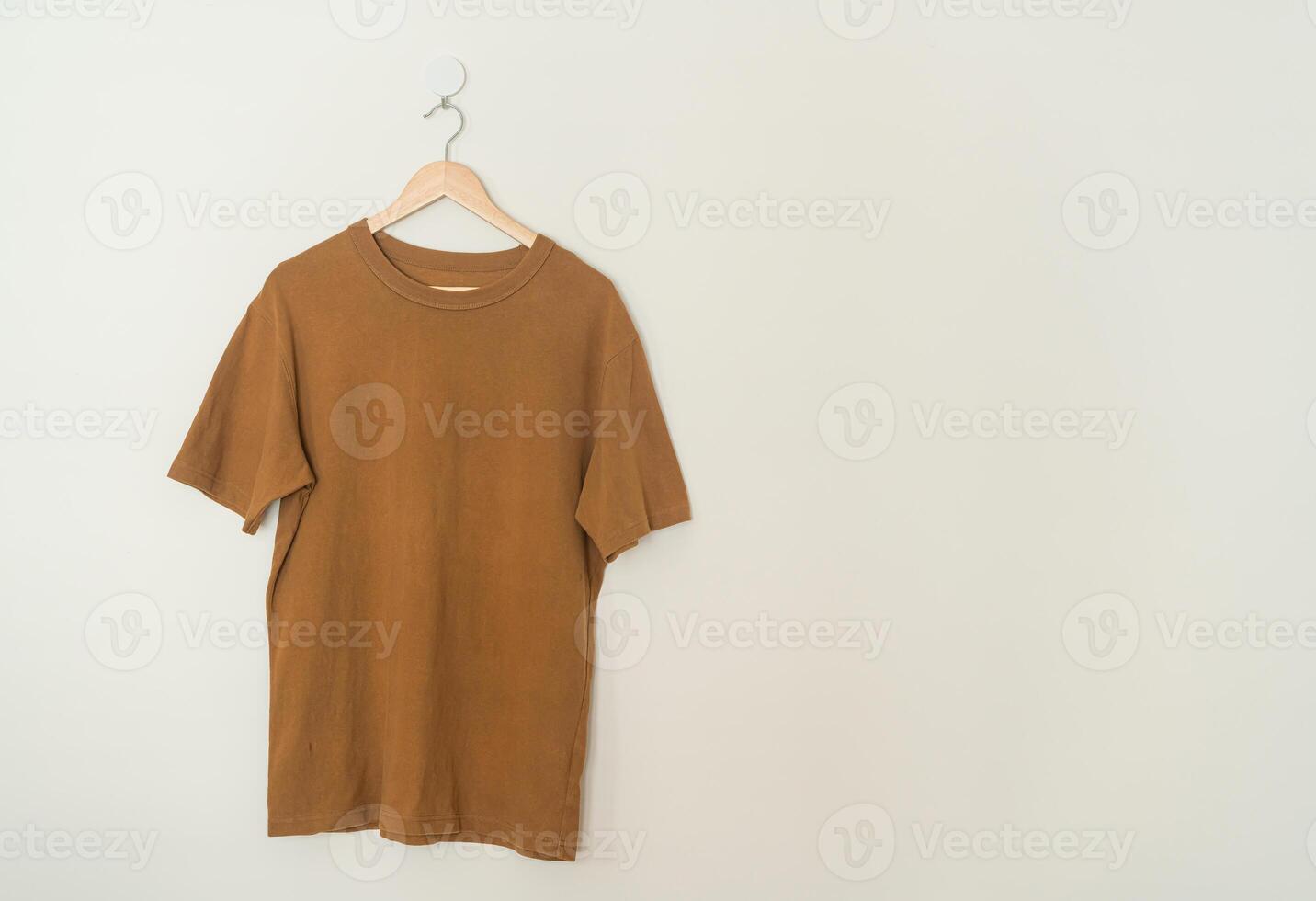 t-shirt hanging with wood hanger photo