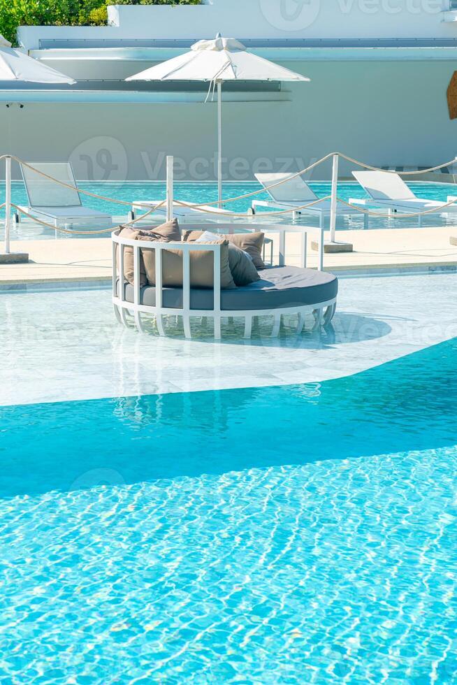 umbrella with bed pool around swimming pool photo