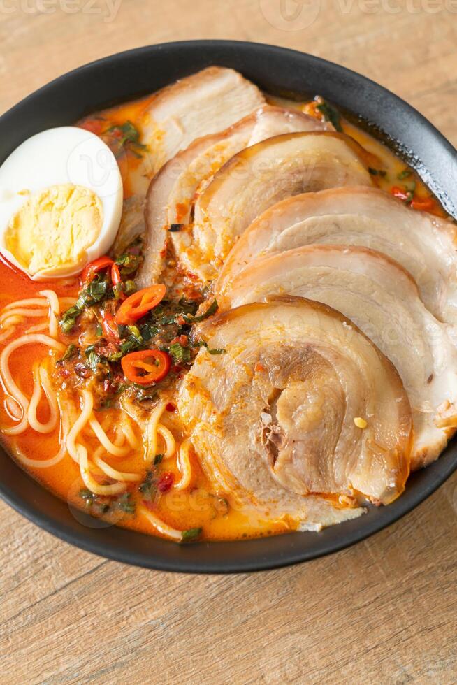 Ramen Noodles Spicy Tomyum Soup with Roast Pork photo