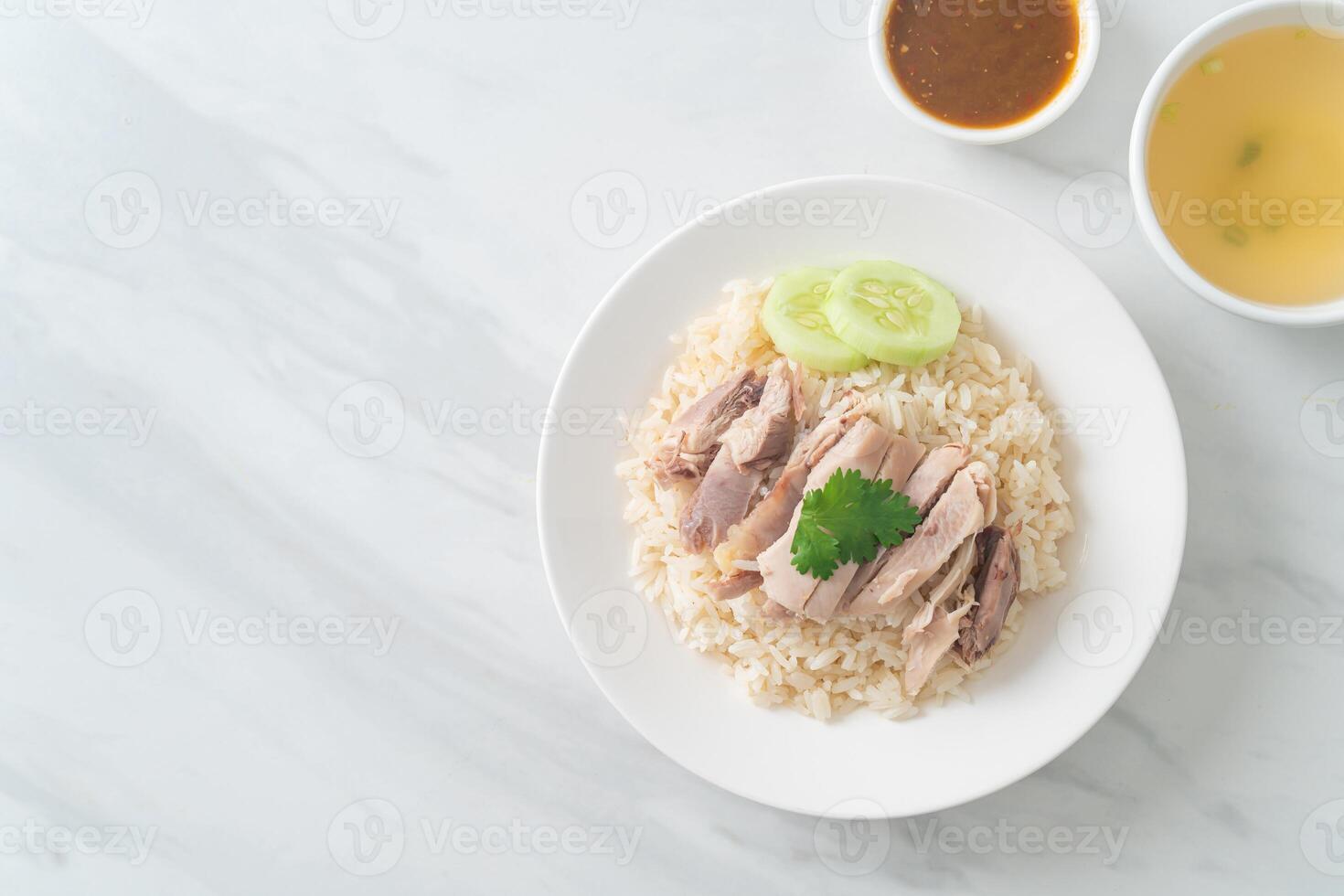 Hainanese Chicken Rice or steamed rice with chicken photo