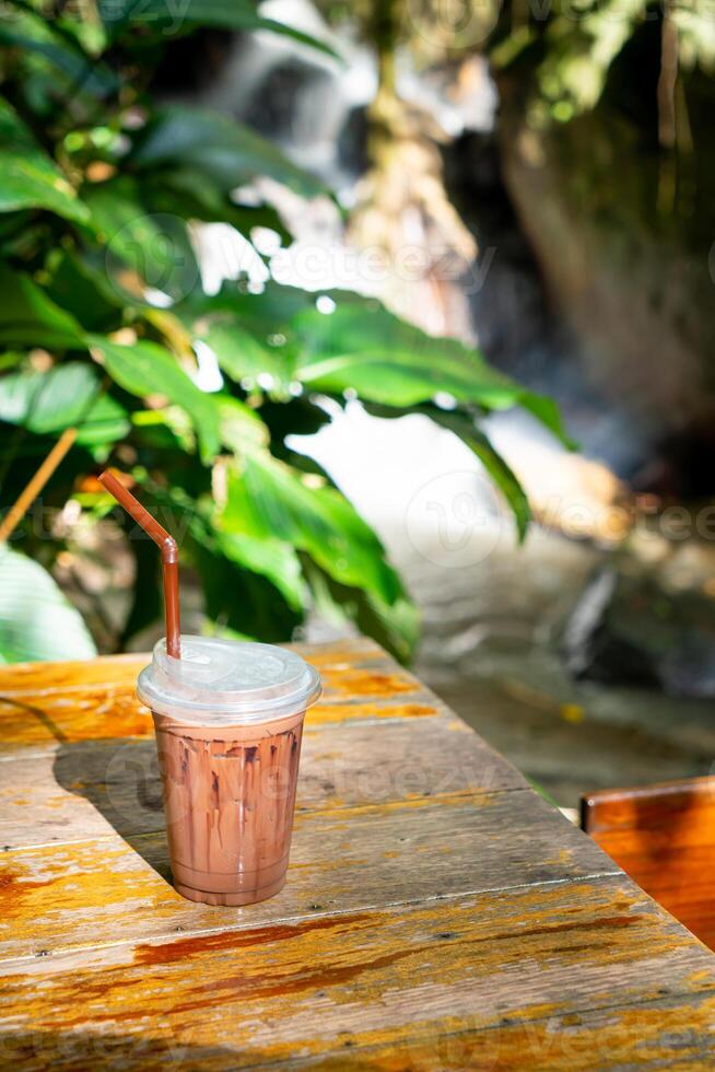 iced chocolate milkshake on table photo