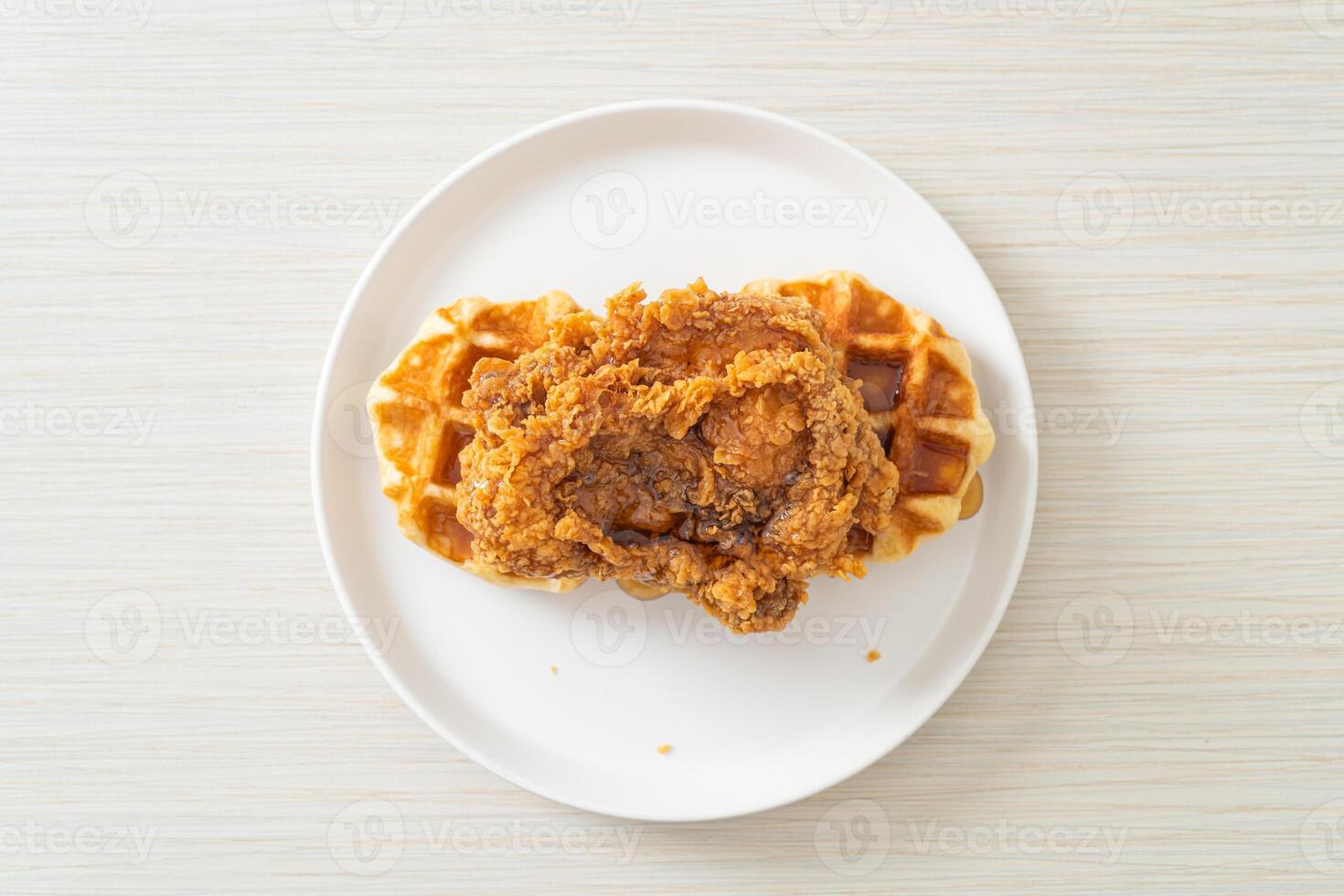 fried chicken waffle with honey or maple syrup photo