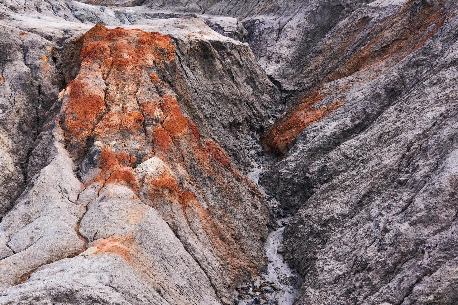 gully in a clay slope devoid of soil photo