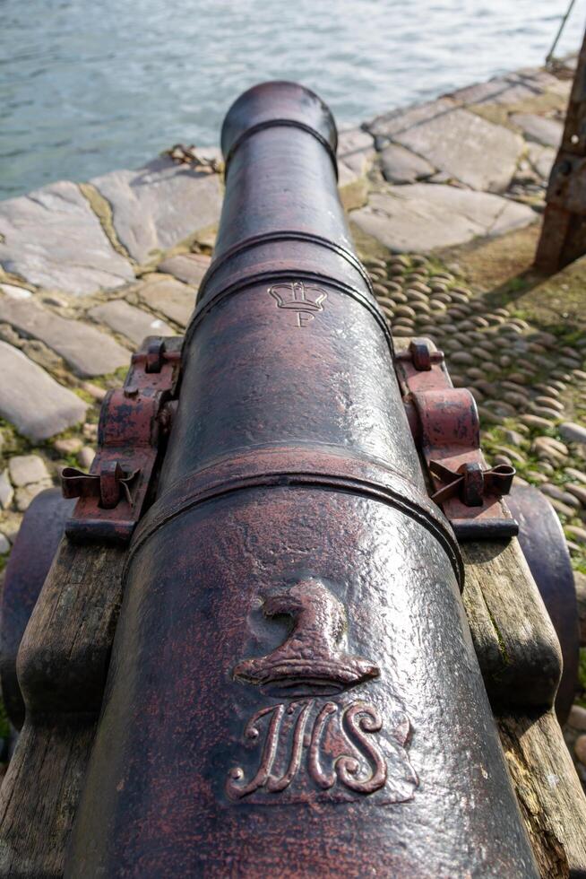 Dartmouth, Devon, UK - January 14. Cannon by the River Dart in Dartmouth, Devon on January 14, 2024 photo