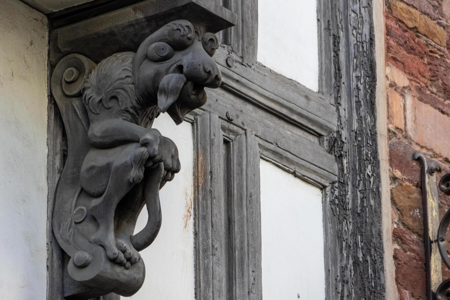 Totnes, Devon, UK - January 16. View of a wooden gargoyle in Totnes, Devon on January 16, 2024 photo