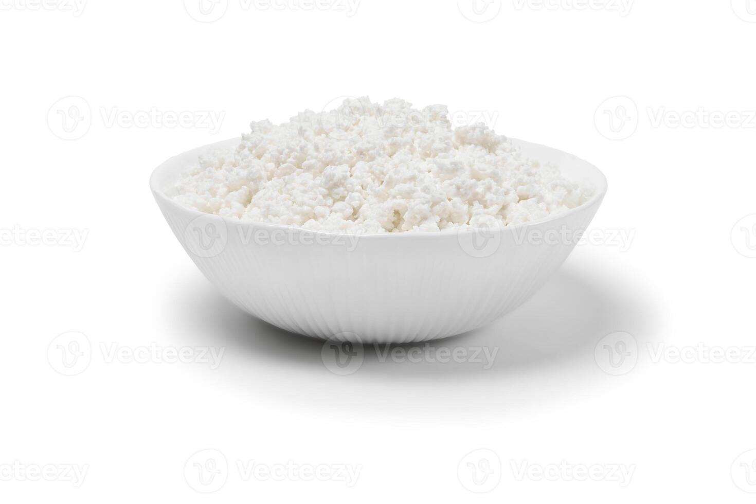 bowl with cottage cheese isolated on a white background photo