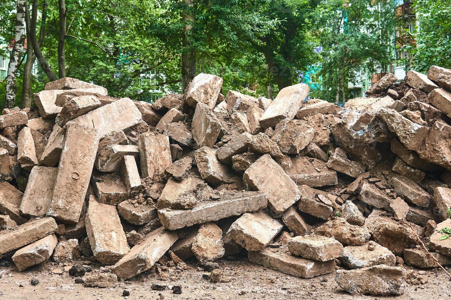 old curbs piled up during road repairs in the city photo