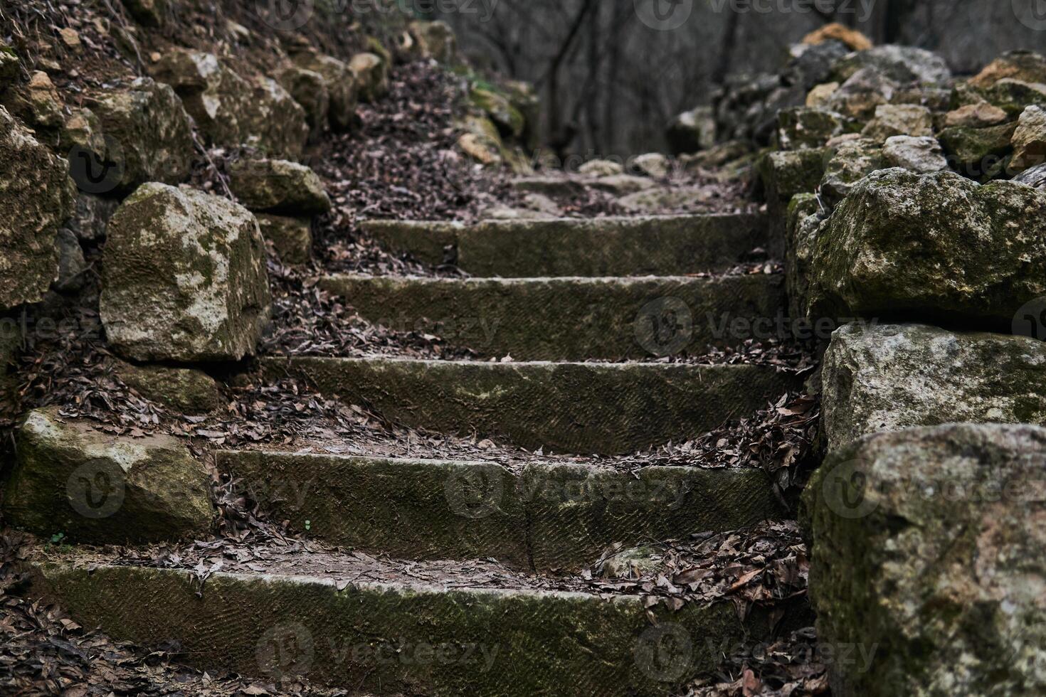antique staircase made of natural stone in gloomy autumn landscape outdoors photo