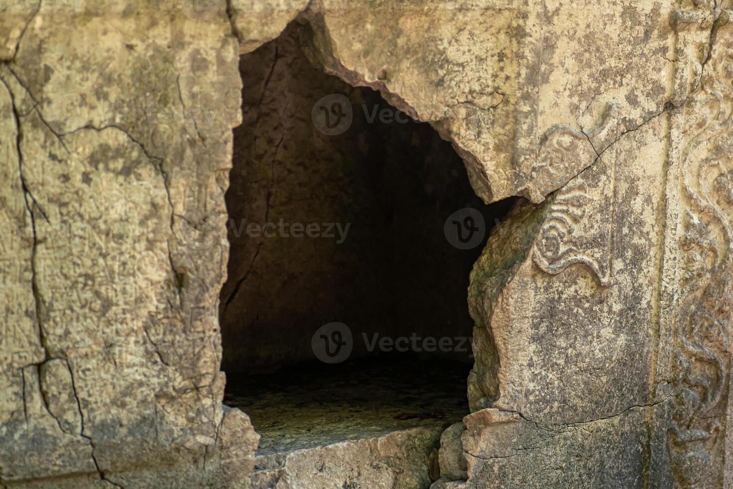 empty sarcophagus with a hole in the wall in the ruins of the antique city of Olympos, Turkey photo