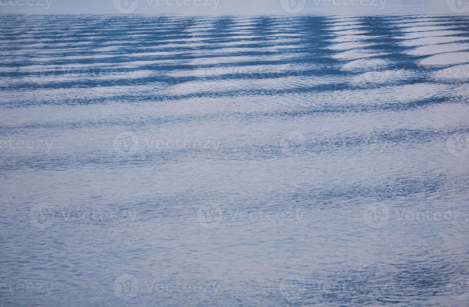 natural background - waves and ripples on the water surface photo