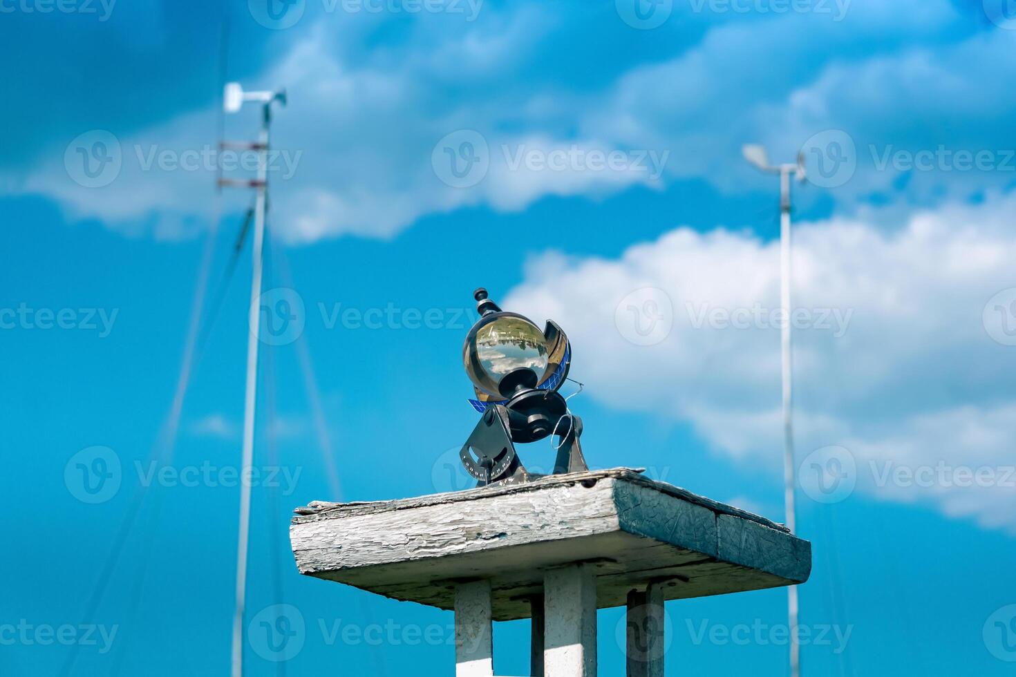 spherical meteorological sunshine recorder heliograph at the weather station against the sky photo