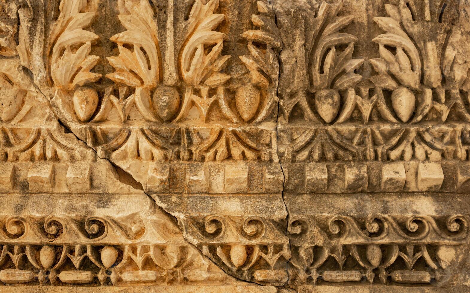 ancient weathered ornament on the ruins of a building in the ancient city of Myra, Turkey photo